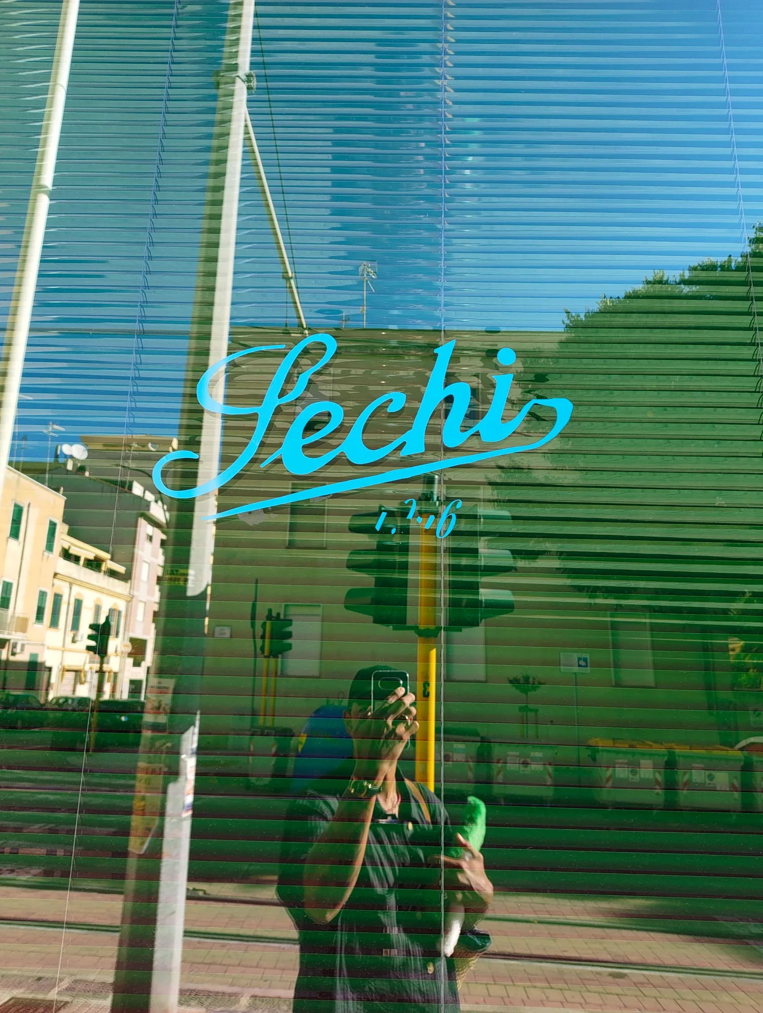 Sechi script lettering on a window